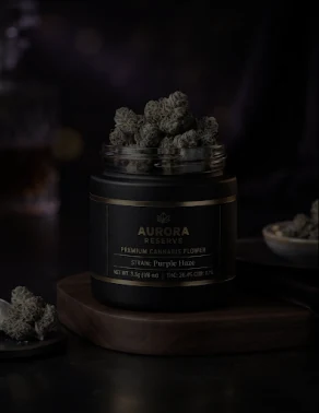 Jar of Aurora Reserve cannabis flower on a walnut tray